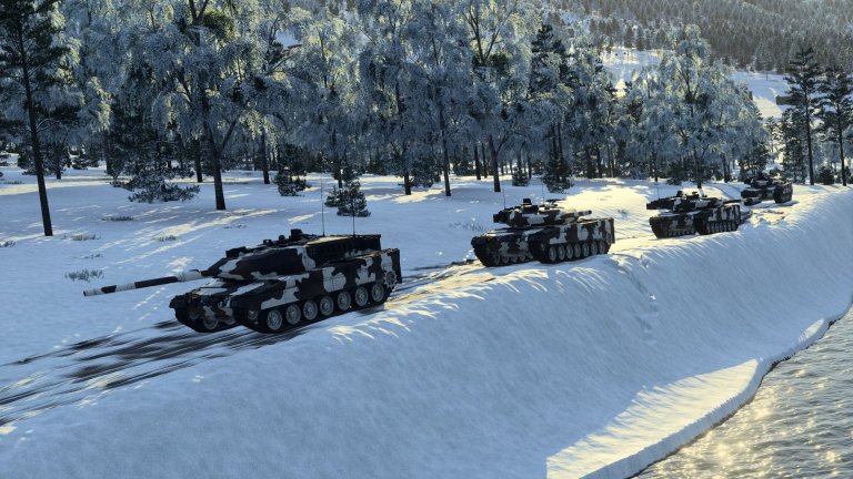 Flere stridsvogner kjører etter hverandre på en vei i vinterlandskap